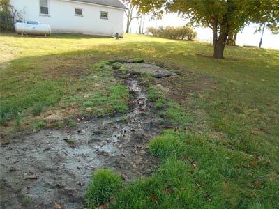 Raw sewage running across yard near home